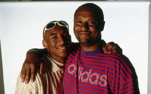 Joe Bryant and his son Kobe Bryant pose for a photo in 2002 [GettyImages]