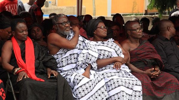 Ebony's parents in white mourning clothes