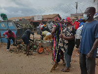 Residents of Akaporiso electoral area cleaning their environment