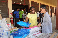 Mrs. Matilda Amissah-Arthur presenting items