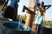 A lady tapping a borehole