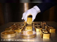 Gold bars and coins are stacked in the safe deposit boxes room of the Pro Aurum gold house in Munich