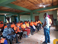 Mr James Twene, the Upper East Regional Director of Department of Gender speaking to the participant