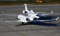 Private jets on a tarmac