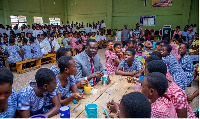 Dr Yaw Osei Adutwum, the Minister of Education among some of the students