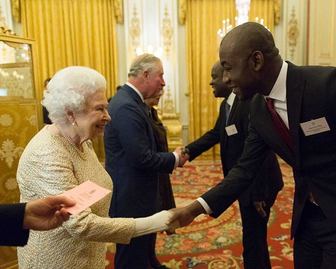 Mr Poku Osei (R) exchanging pleasantness with Queen Elizabeth II