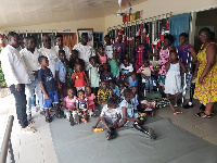 Daniel Laryea in a group photograph with officials and beneficiaries at the centre