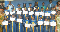 The children in a group picture with dignitaries