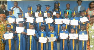 The children in a group picture with dignitaries