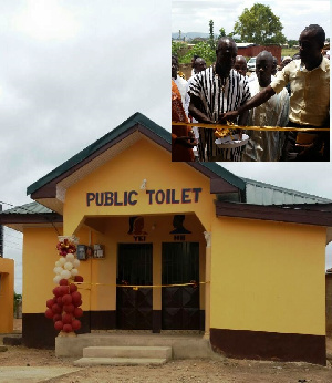 The front of new toilet facility, inset: Assemblyman with assistance of Fozlab MD  cutting the sod