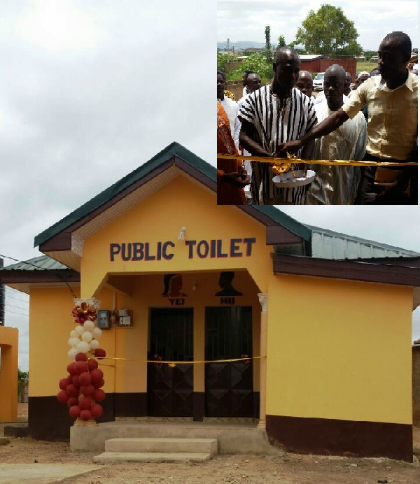 The front of new toilet facility, inset: Assemblyman with assistance of Fozlab MD  cutting the sod