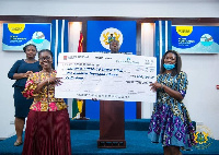 Eunice Osei-Tutu, Corporate Relations Manager at Pernod Ricard presenting the cheque to Ursula Owusu