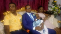 The teenage couple with Bishop Obinim and their baby