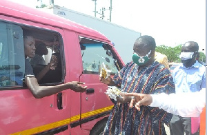 Rev Nikoi(second from right) distributing nose mask after launching the campaign Photo Victor A. Bux