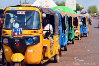 A tricycle transporting passengers