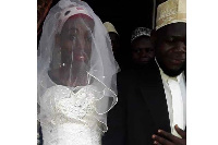 Sheikh Mohammed Mutumba and his 'bride' on their wedding day [photo by  Fred Muzaale]