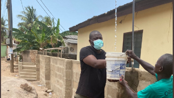 Dumelo assisting community water project