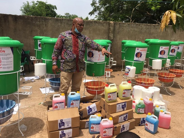 MP for Savelugu, Muhammad Abdul-Samad showing the items for donation