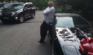 The former head of state posed just beside his new car