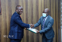 Minister of Lands and Natural Resources, Samuel Abu Jinapor receiving the report