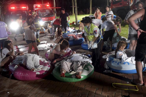 Injured victims from an accidental explosion during a music concert lie on the ground  June 27, 2015