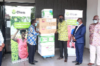 Kenneth Antwi, hands over test Kits to Prof. Ebenezer Oduro