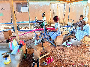 Other rescued teenage girls learning a skill in weaving