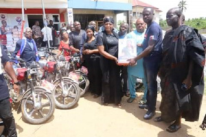 Eugene Arhin presenting cash and other items to support NPP campaign in the Mfantseman constituency