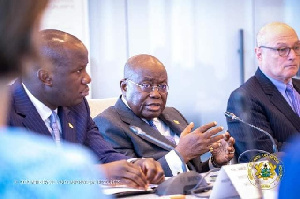 Jinapor listens as Akufo-Addo delivers a speech