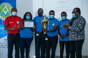 Mr. Ben Hassan Ouattara (left) and Mr. Kwaku Agyeman-Duah (right) in a group picture with winners