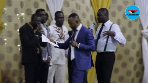 Rev. Isaac Owusu Bempah preaching during a prophetic session in January