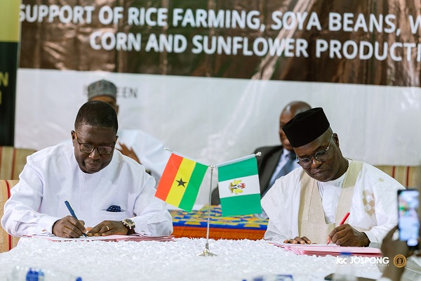 Rev. George Tsidi Blavo and Bashiru Ibrahim signing the MoU