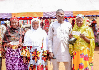 Dr Amin Adam in a pose with some beneficiaries