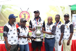 Craig Tandoh(3rd left) receiving his trophy from Mr Appiah