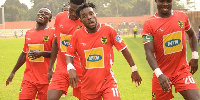 Striker Stephen Nyarko celebrating a goal with tam mates