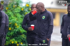 Head Coach of Asante Kotoko Prosper Ogum styled in his tracksuit