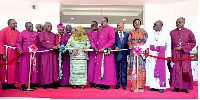 President Samia Suluhu Hassan (C) flanked by Anglican Church of Tanzania bishops and govt. officials