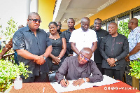 Dr. Mahamudu Bawumia signing the book of condolence