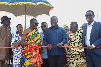 Samuel Jinapor cutting the ribbon for the commissioning of the project