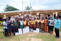 Pupils, teachers and some PTA Executives displaying some of the items in a group photograph