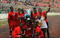 Players of Asante Kotoko jubilanting with the SWAG trophy