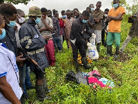 Environmental health personnel with belongings  of the deceased at Loho