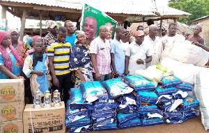 NDC PC for Kumbungu constituency Dr. Hamza Adam presenting relief items