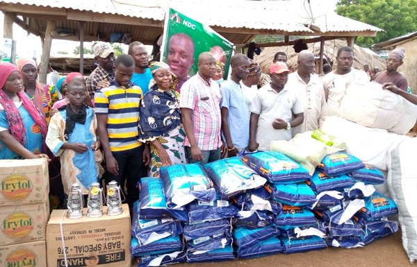 NDC PC for Kumbungu constituency Dr. Hamza Adam presenting relief items