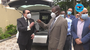 Euroget CEO, Dr Said Deraz handing over the keys of the ambulance to Dr Patrick Aboagye