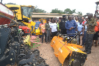 Dr. Owusu Afriyie-Akoto and other dignitaries inspecting some of the farming machines