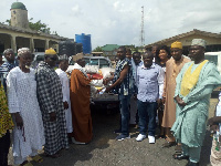 Hon Gilbert Ken Asmah making donation to the Muslim community