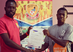 Lambert Osei Owusu (right) after signing the contract