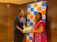 Mrs. Nana Akyaa Obeng-Adiyiah making a presentation to Ms. Harsha Bangari.