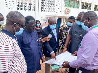 Benito Owusu-Bio inspecting the site plan